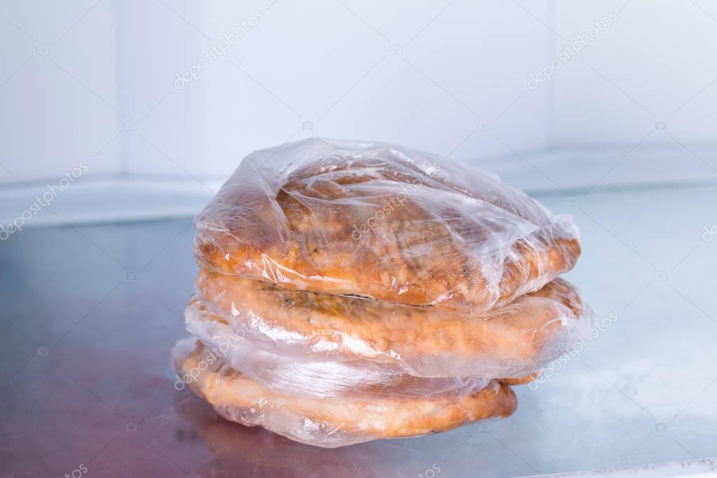 Fried fillet in a bag in a refrigerator