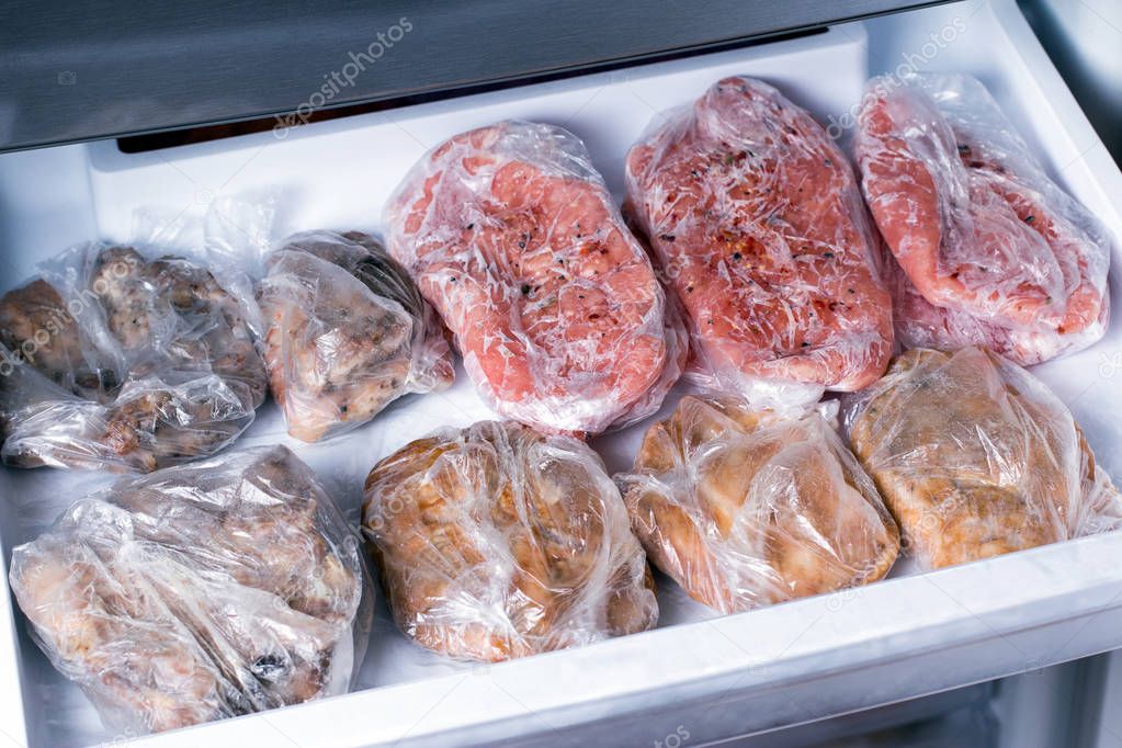 Frozen pork neck chops meat steakin the freezer. Frozen food
