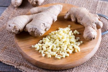 Sliced ginger root on a cutting board clipart