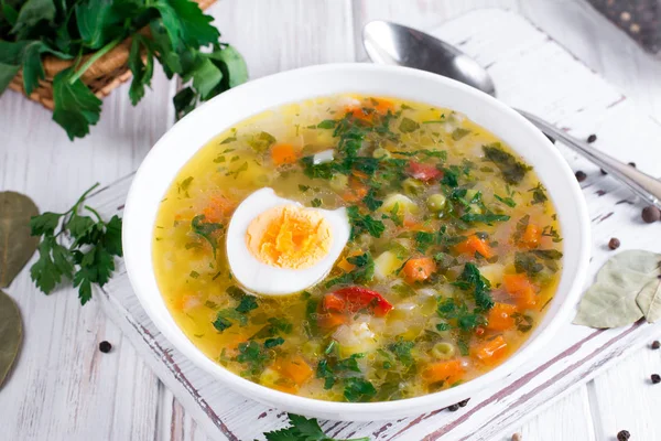 Summer vegetable soup with beans, peas, corn, carrots, chicken, egg, tasty healthy dish for the diet — Stock Photo, Image