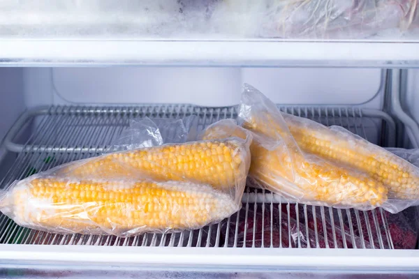 Frozen corn in bag in freezer close up — Stock Photo, Image