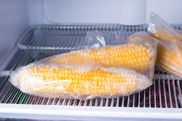 Frozen corn in bag in freezer close up — Stock Photo, Image