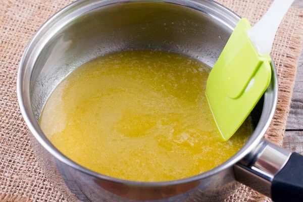 Melted butter in a saucepan — Stock Photo, Image