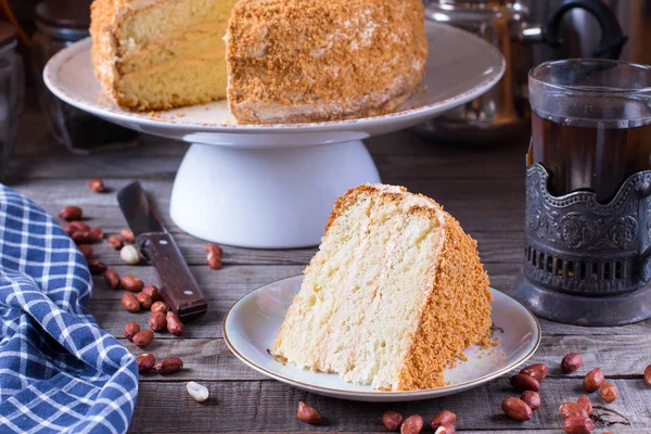 Homemade biscuit cake on a wooden table — Stock Photo, Image
