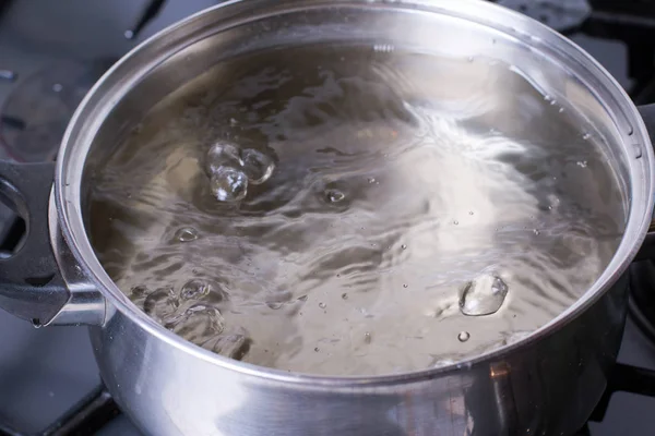 Boiling water in a saucepan — Stock Photo, Image