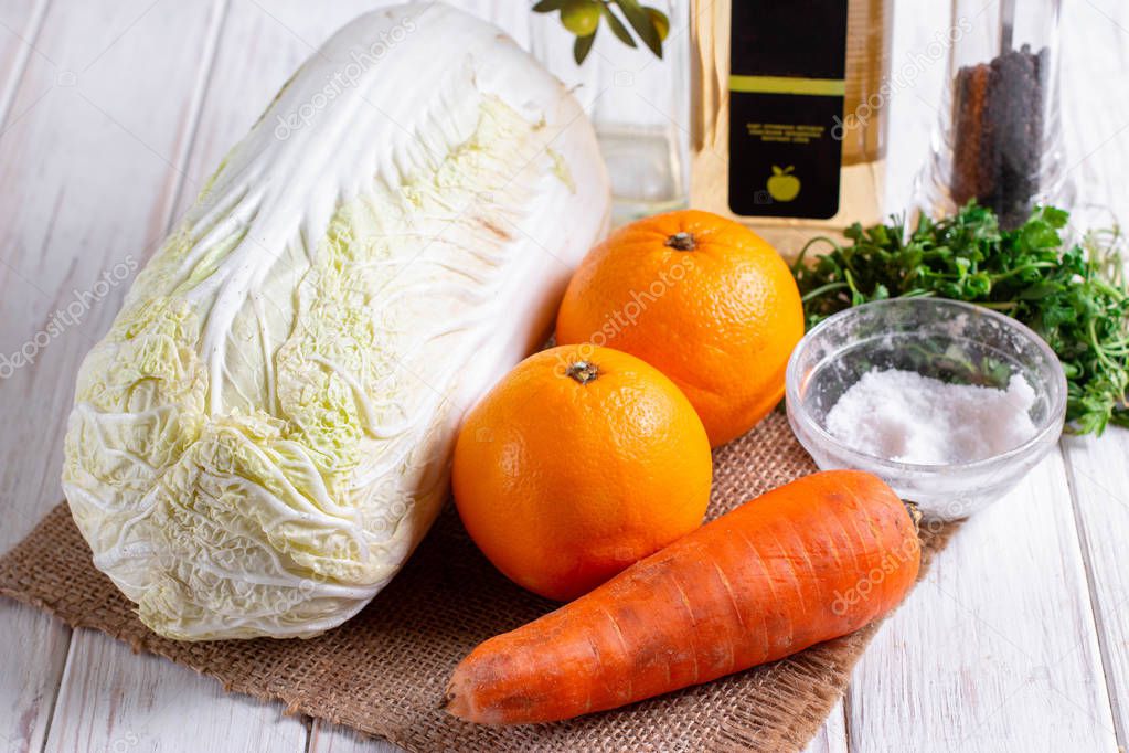 Ingredients for cooking cabbage salad with oranges and carrots