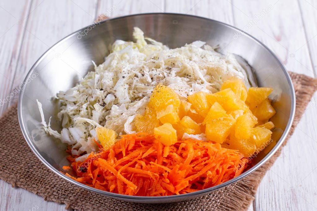 Sliced carrots of cabbage and oranges, carrots
