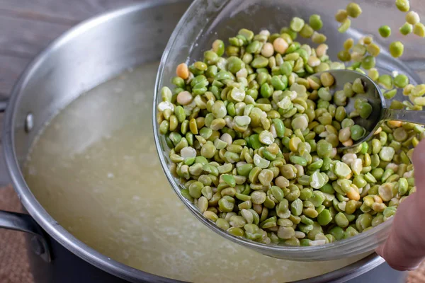 Cooking soup. Green peas in a bowl in a soup — Stock Photo, Image