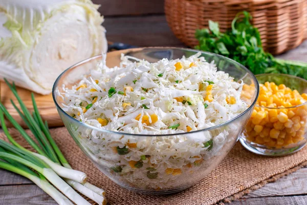 Chinese cabbage salad with sweet corn in a glass bowl — Stock Photo, Image