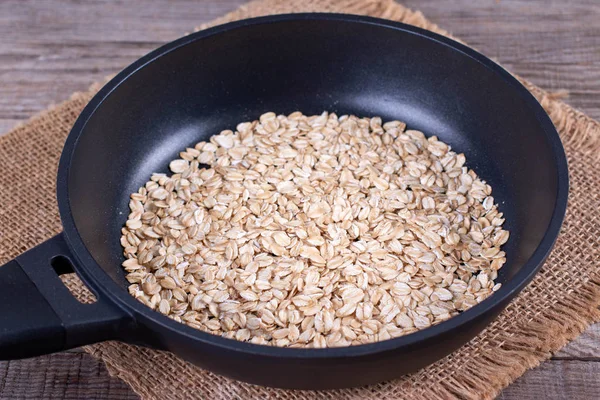 Oatmeal in a frying pan — 스톡 사진