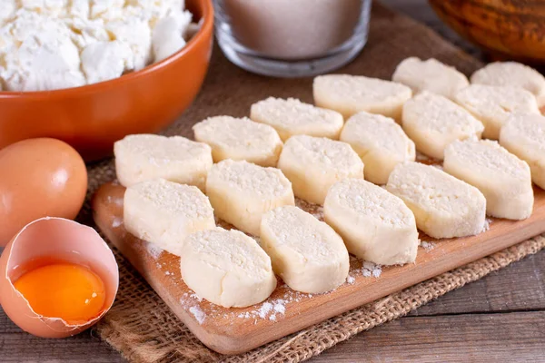 Dumplings from cottage cheese. Lazy dumplings close-up on a cutting board. Cottage cheese dumplings