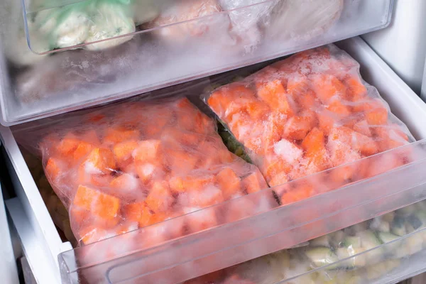 Bags Frozen Vegetables Refrigerator Frozen Pumpkin Cubes Closeup — Stock Photo, Image