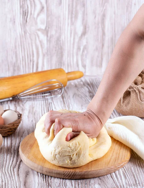 Hands Kneading Yeast Dough Cutting Board White Table Vertical — Stock Photo, Image