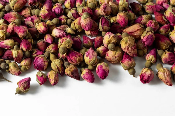red and pink rose buds tea on white banner