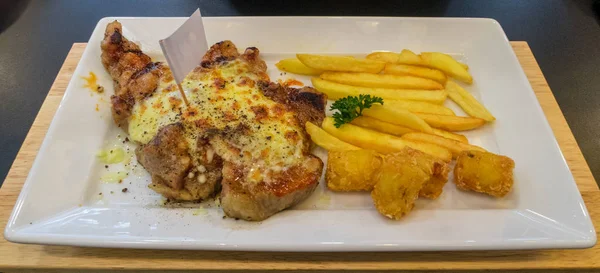 Pork steak dubble Cheese and French fries Served on a white plat — Stock Photo, Image