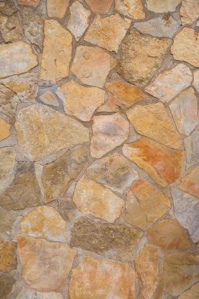 En textur av stenar, även lämplig som bakgrund — Stockfoto