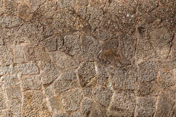 En textur av stenar, även lämplig som bakgrund — Stockfoto