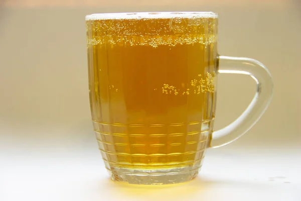 Small glass mug with beer and bubbles