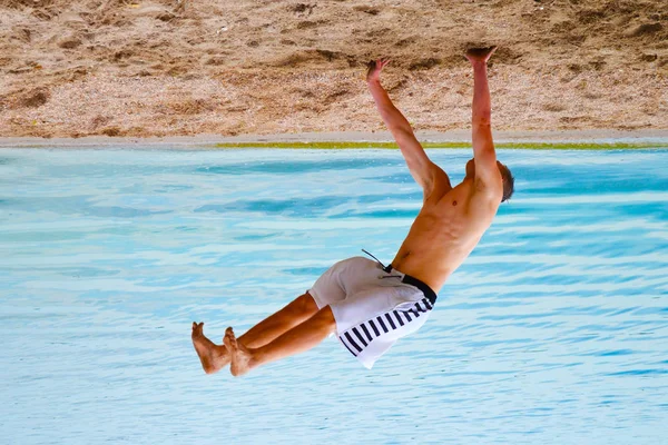 Handstand Beach Sea Acrobatic Stunt Stock Image