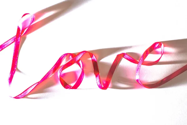 Lettering amor fita vermelha, dia dos namorados . — Fotografia de Stock