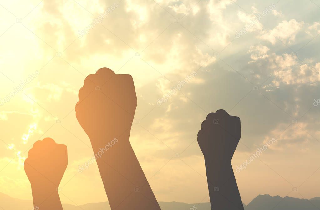 Silhouette hands fist with sun lighting in morning