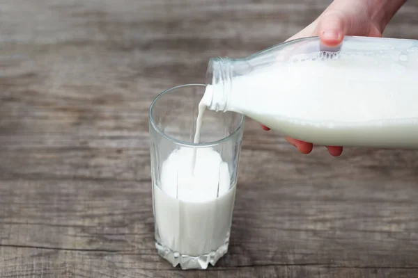 pouring milk into glass