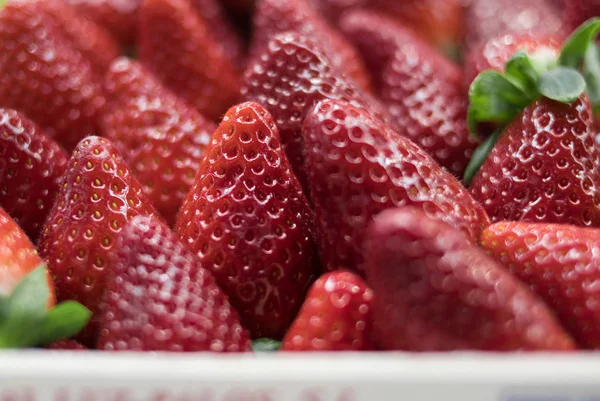red fresh strawberry in a close up at the market