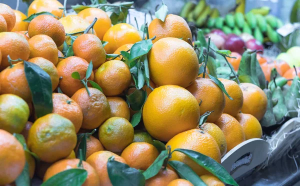 fresh mandarins on the counter at the marketplace for selling