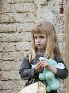 a portrait of a little girl outdoors clipart