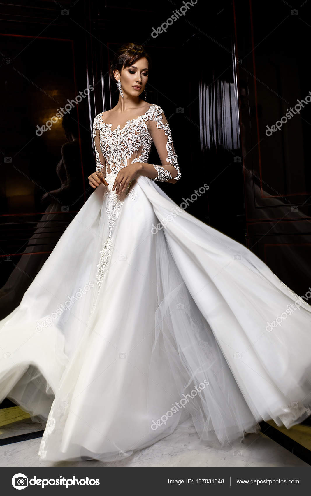Elegant woman in blue ball gown dress standing and posing on a sunny  evening at city street. Fashion model full length portrait Stock Photo -  Alamy