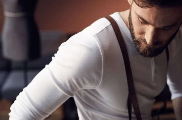 Closeup portrait of handsome bearded man wearing white shirt with brown leather suspenders — Stock Photo, Image