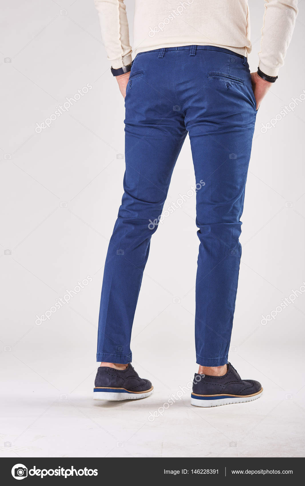 blue pants and black shoes
