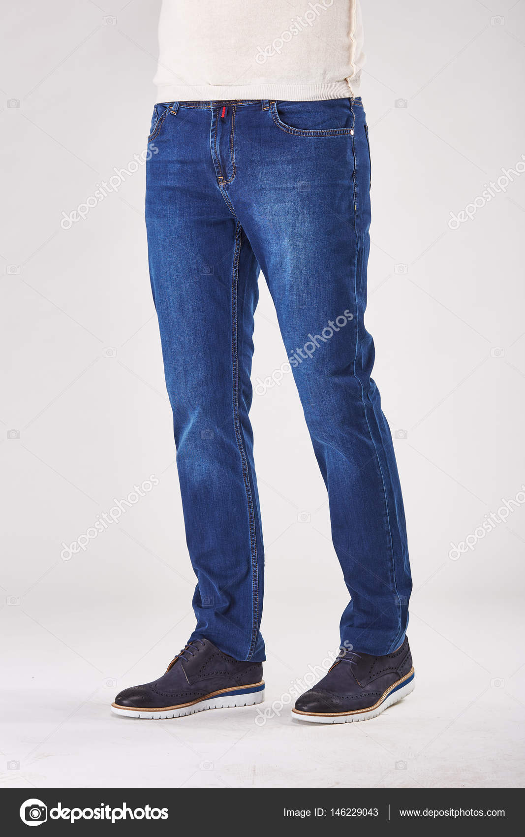 black shoes on blue jeans
