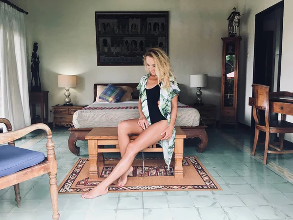 Attractive blonde woman in a hotel room, Bali, Indonesia