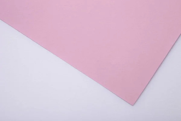 Arka plan olarak pembe ve beyaz pastel kağıt dokusu. Üst görünüm