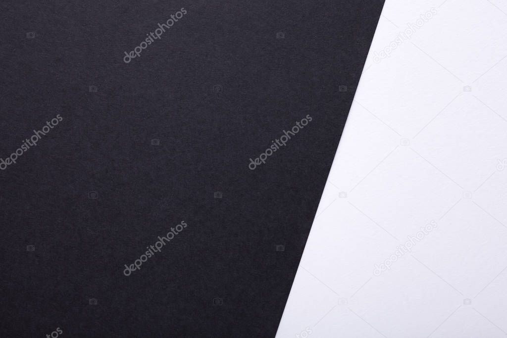 Black and white pastel paper texture as background. Top view