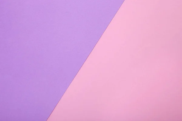 Pink and purple paper as background. Two colored pastel paper texture, top view with place for text