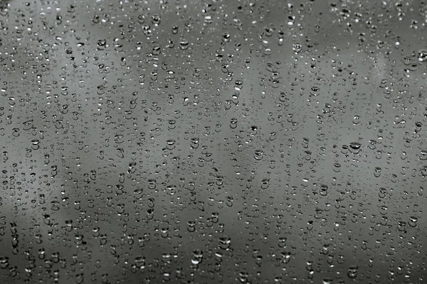 Gocce d'acqua sulla macchina. Contesto. Gocce di pioggia . — Foto Stock
