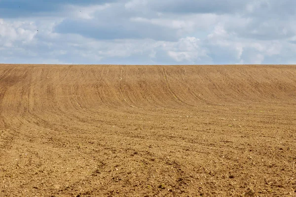 A large field is plowed and ready for sowing. — 스톡 사진
