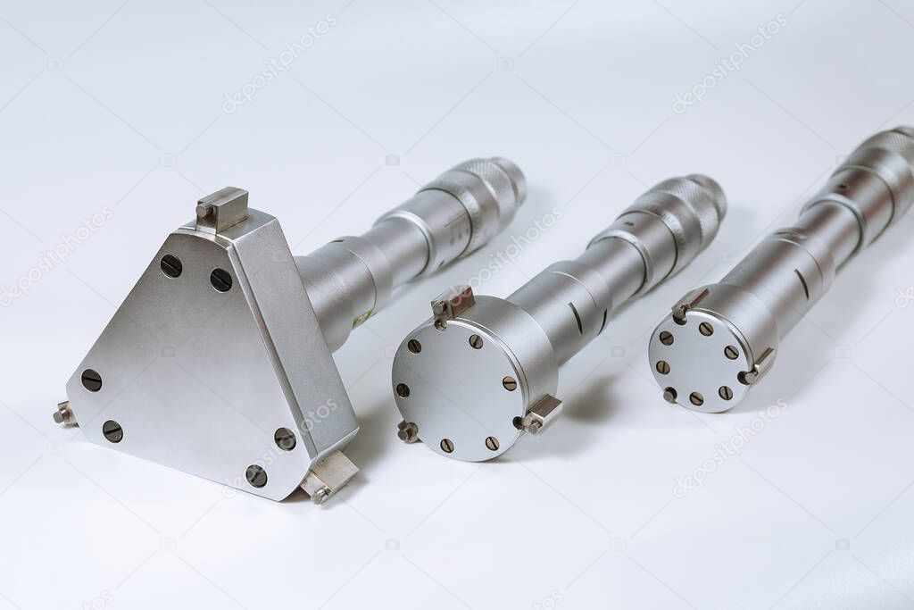 Set of calibration micrometers. Device for accurately measuring the diameter of the hole, on a white background.