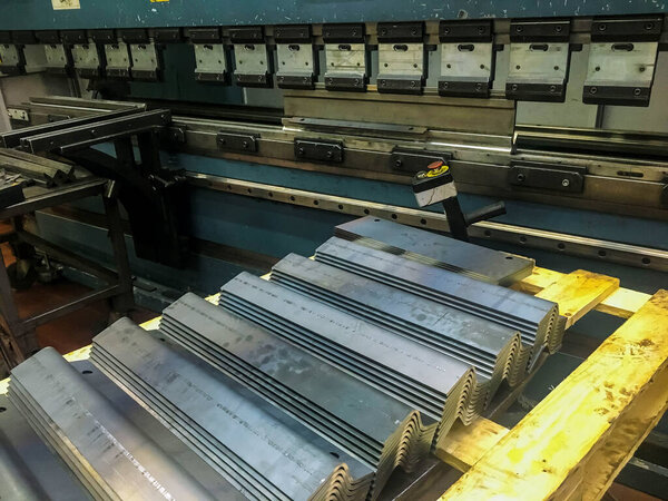 Sheet metal bending in factory by bending mashine.