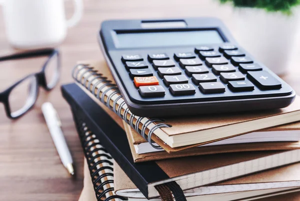 Office desk with calculator — Stock Photo, Image