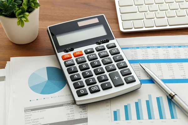 Financial accounting with chart and calculator — Stock Photo, Image