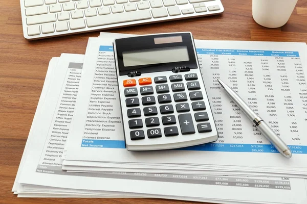 Calculator with accounting data — Stock Photo, Image
