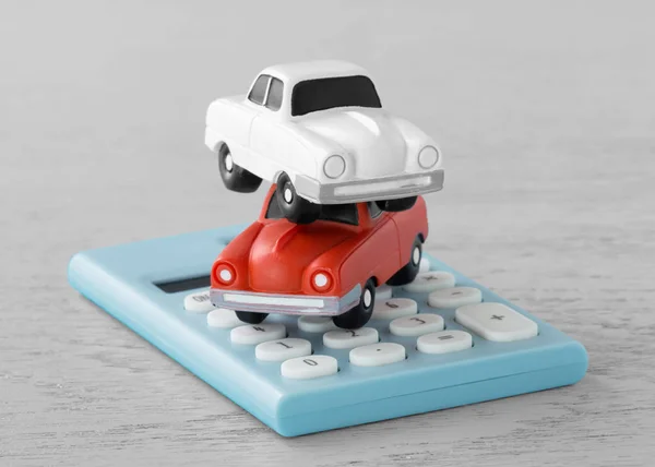 Toy cars on calculator — Stock Photo, Image