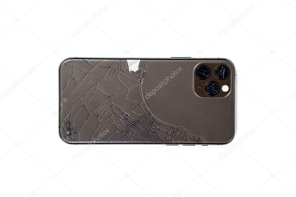 Broken lens on smartphone, isolated white background, back side, lens, camera