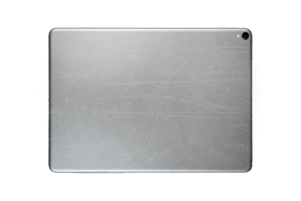 Scratched back side of tablet isolated on white background — Stock Photo, Image