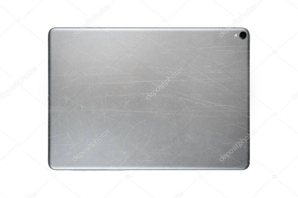 Scratched back side of tablet isolated on white background