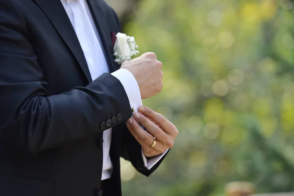 Groom Touches Cufflinks Park Close — Stock Photo, Image