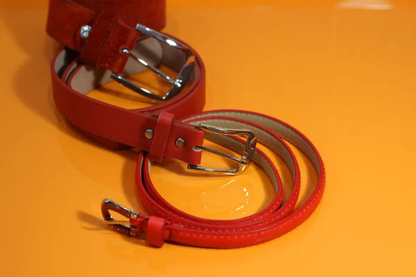 red belt on orange background